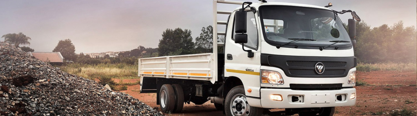 White dropside truck on a building site